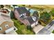 Aerial view of a brick house with a two-car garage and a pond nearby at 7178 Lockford N, Avon, IN 46123