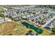 Aerial view of a large neighborhood with houses and a pond at 7178 Lockford N, Avon, IN 46123