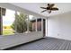 Peaceful screened porch overlooking a green space, complete with a ceiling fan at 7178 Lockford N, Avon, IN 46123