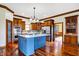Spacious kitchen with island, stainless steel appliances, and hardwood floors at 7178 Lockford N, Avon, IN 46123