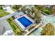 Community pool with a blue cover and surrounding residential area at 7178 Lockford N, Avon, IN 46123