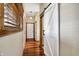 Long hallway with hardwood floors, white barn door, and neutral-toned walls at 7178 Lockford N, Avon, IN 46123