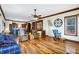 Open living room with hardwood floors and kitchen view at 7178 Lockford N, Avon, IN 46123