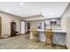 Basement kitchenette with modern appliances and bar seating at 7178 Lockford N, Avon, IN 46123
