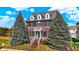 Brick two-story house with landscaping and a walkway at 7178 Lockford N, Avon, IN 46123