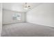 Large main bedroom with ceiling fan and grey carpet at 4633 Angelica Dr, Indianapolis, IN 46237