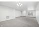 Spacious living room with gray carpeting and an open floor plan at 4633 Angelica Dr, Indianapolis, IN 46237