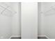 Spacious walk-in closet with double hanging rods and shelving at 4633 Angelica Dr, Indianapolis, IN 46237