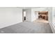 Living room with grey carpet and views of the kitchen at 4633 Angelica Dr, Indianapolis, IN 46237