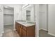 Double vanity bathroom with granite countertop and walk-in closet at 4633 Angelica Dr, Indianapolis, IN 46237
