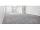 Spacious living room with gray carpeting and an open floor plan at 4633 Angelica Dr, Indianapolis, IN 46237