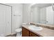 Clean bathroom with wood vanity and a mirror at 4633 Angelica Dr, Indianapolis, IN 46237