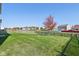Backyard with a grassy area, wooden fence, and a pond at 4633 Angelica Dr, Indianapolis, IN 46237