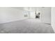 Spacious living room with gray carpeting and an open floor plan at 4633 Angelica Dr, Indianapolis, IN 46237