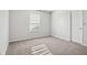 Bright bedroom with grey carpet and window with blinds at 4633 Angelica Dr, Indianapolis, IN 46237