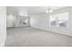 Spacious living room with grey carpet and large windows at 4633 Angelica Dr, Indianapolis, IN 46237
