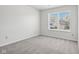 Charming bedroom with a large window and grey carpet at 4633 Angelica Dr, Indianapolis, IN 46237