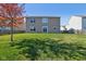 Spacious backyard with a large grassy area and a tree at 4633 Angelica Dr, Indianapolis, IN 46237