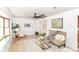 Light-filled living room with a comfy couch and large windows at 823 Alden Dr, Fortville, IN 46040