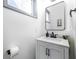 Small but stylish bathroom with white vanity and black fixtures at 2221 E Michigan St, Indianapolis, IN 46201