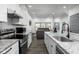 Modern kitchen with stainless steel appliances and white cabinets at 2221 E Michigan St, Indianapolis, IN 46201