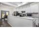 Modern kitchen with white cabinets, granite countertops, and stainless steel appliances at 2221 E Michigan St, Indianapolis, IN 46201