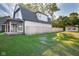 Charming house exterior with a large yard and wooden fence at 2221 E Michigan St, Indianapolis, IN 46201