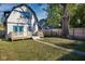 Backyard view of house with deck and large tree at 2221 E Michigan St, Indianapolis, IN 46201