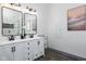 Modern bathroom with double vanity, large mirrors, and hexagon tile shower at 2221 E Michigan St, Indianapolis, IN 46201