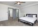 Spacious bedroom with gray carpet, and access to the bathroom and hallway at 2221 E Michigan St, Indianapolis, IN 46201