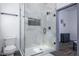 Clean bathroom with a large walk-in shower and marble tile at 2221 E Michigan St, Indianapolis, IN 46201