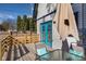 Outdoor deck with seating area and blue doors at 2221 E Michigan St, Indianapolis, IN 46201