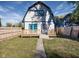 Backyard view, showcasing a deck and grassy area at 2221 E Michigan St, Indianapolis, IN 46201