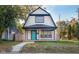 Charming 2-story house with a newly renovated front porch and landscaping at 2221 E Michigan St, Indianapolis, IN 46201