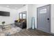 Cozy living room features dark gray couch and a modern coffee table at 2221 E Michigan St, Indianapolis, IN 46201