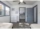 Spacious bedroom with double doors leading to a closet at 2221 E Michigan St, Indianapolis, IN 46201