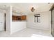 Cozy dining area with stained glass window and kitchen access at 8168 Shorewalk Dr # A, Indianapolis, IN 46236