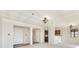 Open concept living room with hardwood floors and kitchen access at 8168 Shorewalk Dr # A, Indianapolis, IN 46236