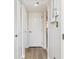 Clean hallway with hardwood floors, leading to bedrooms and bathroom at 8168 Shorewalk Dr # A, Indianapolis, IN 46236