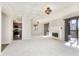 Spacious living room with fireplace and access to a deck at 8168 Shorewalk Dr # A, Indianapolis, IN 46236