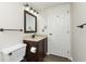 Updated bathroom with vanity, toilet, and dark wood cabinets at 8168 Shorewalk Dr # A, Indianapolis, IN 46236