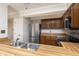 Galley kitchen with stainless steel appliances and wood cabinets at 8168 Shorewalk Dr # A, Indianapolis, IN 46236
