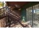 Wooden deck with glass door and artificial greenery wall at 8168 Shorewalk Dr # A, Indianapolis, IN 46236
