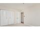 Empty bedroom with double doors to closet and neutral walls at 8168 Shorewalk Dr # A, Indianapolis, IN 46236