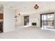 Open living room with fireplace, access to kitchen, and neutral decor at 8168 Shorewalk Dr # A, Indianapolis, IN 46236