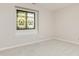 Simple bedroom with neutral walls, carpeting, and stained glass window at 8168 Shorewalk Dr # A, Indianapolis, IN 46236