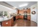 Open concept kitchen with island, wood cabinets and breakfast bar at 3159 Hurst St, Whiteland, IN 46184