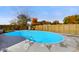 Kidney-shaped swimming pool with a wood fence at 232 N Church St, Morgantown, IN 46160
