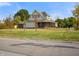 Two-story house with a large yard and attached garage at 232 N Church St, Morgantown, IN 46160