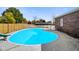 Inviting kidney-shaped pool with slide, ready for summer fun! at 232 N Church St, Morgantown, IN 46160